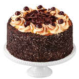 Black Forest Gateau on a white pedestal stand