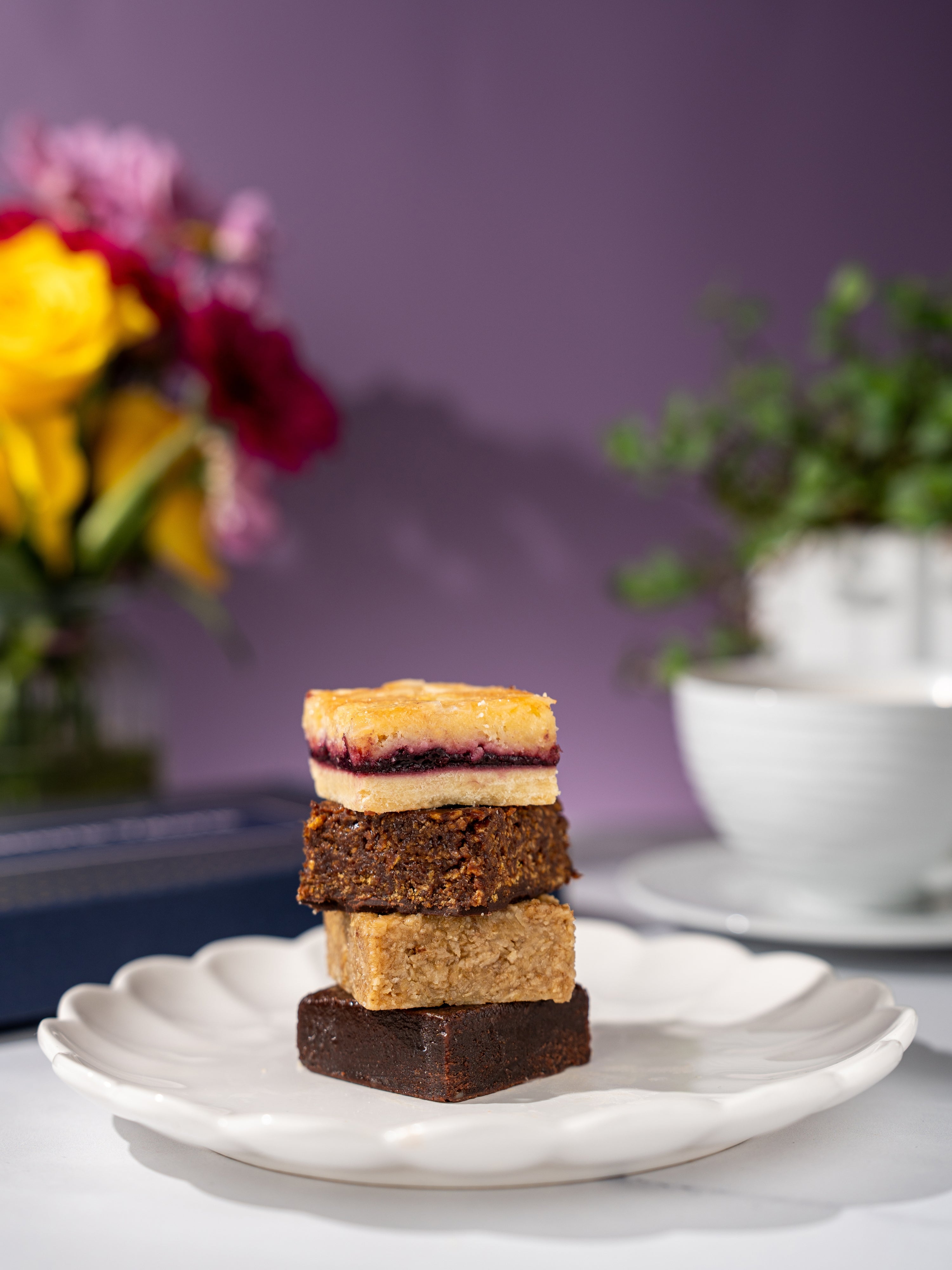 Patisserie Valerie's handmade The Old School Favourites Classic Treat Box being opened to reveal twelve traybake squares