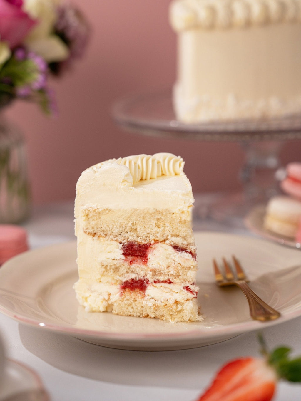 Patisserie Valerie's handmade Vintage Heart Cake being sliced to reveal jam-layered sponge